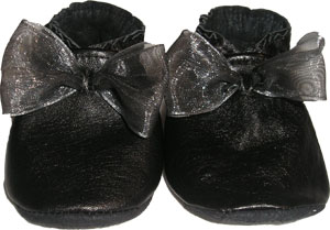A dressy black leather crib shoe with an organza bow.