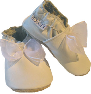 A classy snow white crib shoe with an organza bow.